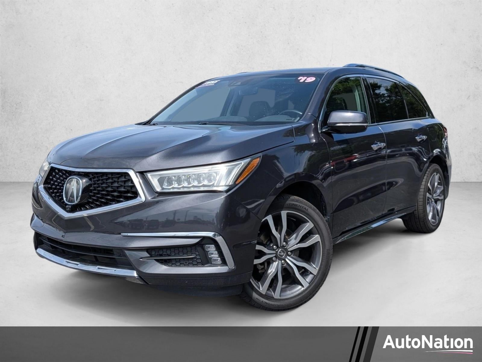2019 Acura MDX FWD w/Advance Pkg in Gunmetal Metallic — front three-quarter view
